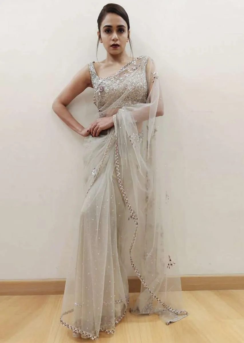 Amruta Khanvilkar in Kalki grey sheer net saree with floral embroidered butti