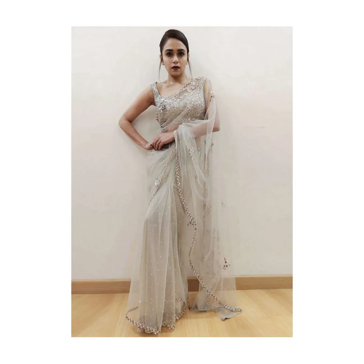 Amruta Khanvilkar in Kalki grey sheer net saree with floral embroidered butti