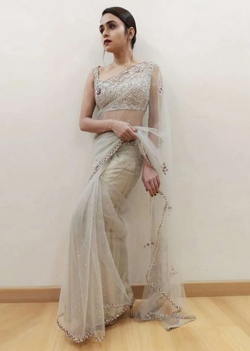 Amruta Khanvilkar in Kalki grey sheer net saree with floral embroidered butti